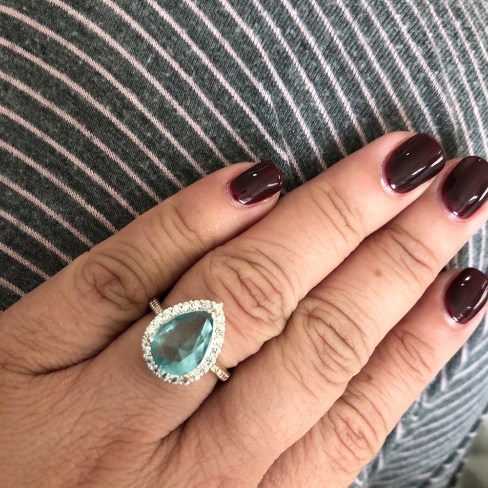 Blue pear shape with halo cocktail ring